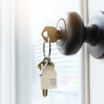 key-ring-with-a-house-on-it-inserted-in-a-front-do-2026-01-08-22-22-03-utc
