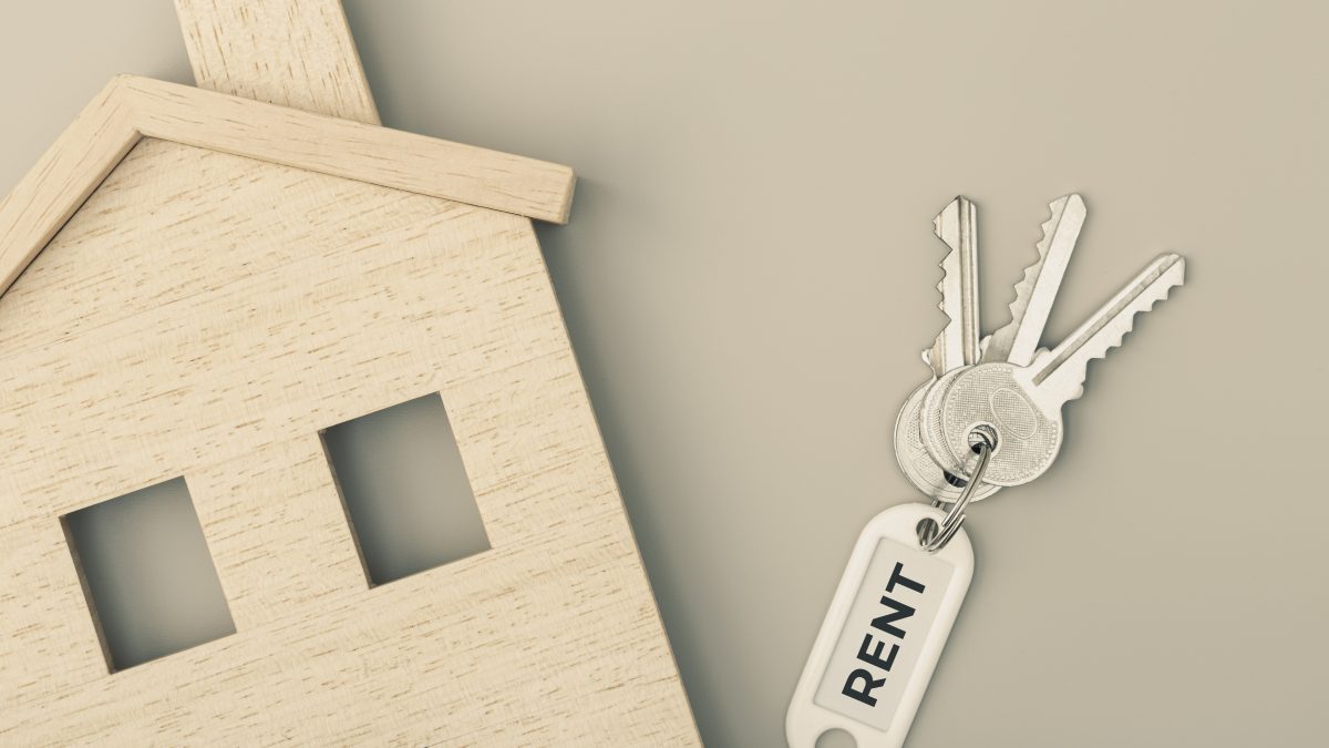 Rent a house concept. Real estate market. House icon with keys. Copy space. Top view