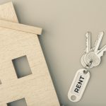 Rent a house concept. Real estate market. House icon with keys. Copy space. Top view