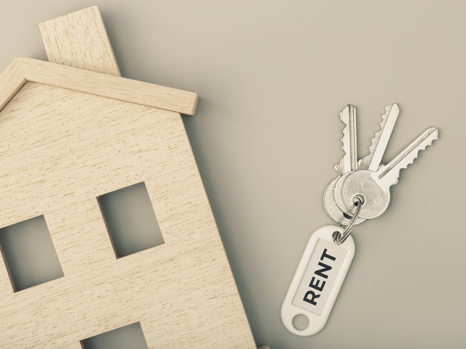Rent a house concept. Real estate market. House icon with keys. Copy space. Top view